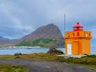 Iceland. Lighthouse Osholar, Bolungarvik at fjord Isafjardardjup during autumn. Art Print